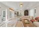Open living area with marble floors, coffered ceiling and seamless transition to the dining and kitchen area at 520 Lafayette Blvd, Oldsmar, FL 34677