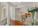 Upstairs hallway with wood floors, transom window and stylish decor at 520 Lafayette Blvd, Oldsmar, FL 34677