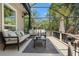 Comfortable screened patio featuring cozy seating and a scenic view at 520 Lafayette Blvd, Oldsmar, FL 34677