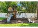 Backyard with a wooden play structure at 520 Lafayette Blvd, Oldsmar, FL 34677
