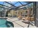 Inviting screened-in pool area featuring comfortable seating, lounging options, and a serene atmosphere at 520 Lafayette Blvd, Oldsmar, FL 34677