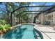 Relaxing pool with a lush tropical waterfall feature at 520 Lafayette Blvd, Oldsmar, FL 34677