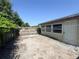 Enclosed backyard with a paved patio and privacy fencing at 5316 Drift Tide Dr, New Port Richey, FL 34652
