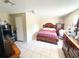 This cozy bedroom features an ample space, light walls and lots of furniture at 5316 Drift Tide Dr, New Port Richey, FL 34652