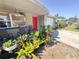 Inviting exterior of a single-story home showcasing front porch sitting area and nicely landscaped yard at 5316 Drift Tide Dr, New Port Richey, FL 34652
