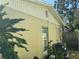 Exterior side of the home featuring the roofline, siding, and a window at 5316 Drift Tide Dr, New Port Richey, FL 34652