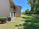 View of backyard with well-maintained grass and a privacy fence on the property line at 6410 Spring Flower Dr # 26, New Port Richey, FL 34653