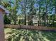 View of the backyard and lush landscaping from the screened balcony at 6410 Spring Flower Dr # 26, New Port Richey, FL 34653