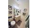 Bathroom with a toilet, vanity, mirror, and decor at 6410 Spring Flower Dr # 26, New Port Richey, FL 34653