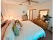 Spacious bedroom with closet, dresser, and a ceiling fan at 6410 Spring Flower Dr # 26, New Port Richey, FL 34653