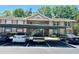 Inviting condo building with covered parking, neat landscaping, and a classic architectural design at 6410 Spring Flower Dr # 26, New Port Richey, FL 34653