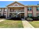 Charming condo building with well-maintained landscaping and inviting staircases at 6410 Spring Flower Dr # 26, New Port Richey, FL 34653