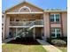 Charming condominium building featuring well-maintained landscaping and a welcoming entrance at 6410 Spring Flower Dr # 26, New Port Richey, FL 34653