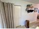 Hallway featuring closet, in-unit laundry area and storage, with vinyl floors at 6410 Spring Flower Dr # 26, New Port Richey, FL 34653