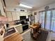 Modern kitchen features stainless steel appliances, wooden butcher block countertops and natural light from slider at 6410 Spring Flower Dr # 26, New Port Richey, FL 34653