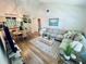 Inviting living room with a large sofa, warm lighting, and stylish decor at 6410 Spring Flower Dr # 26, New Port Richey, FL 34653