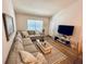 Comfortable living room with a large sofa, soft lighting, and a relaxing atmosphere at 6410 Spring Flower Dr # 26, New Port Richey, FL 34653