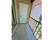 Screened patio with tile flooring and a view of the outdoor area at 6410 Spring Flower Dr # 26, New Port Richey, FL 34653