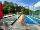 Shuffleboard and bocce courts with benches and green surroundings for community enjoyment at 6410 Spring Flower Dr # 26, New Port Richey, FL 34653