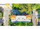 An eye-level aerial view shows the architecture, landscaping, and location of the building at 658 Siren Wind Ln, Clearwater, FL 33756