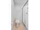 Bathroom with a toilet, tile flooring, and enclosed glass door shower at 658 Siren Wind Ln, Clearwater, FL 33756