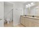 Bathroom featuring double vanity, granite countertops, and a glass-enclosed shower at 658 Siren Wind Ln, Clearwater, FL 33756