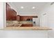 Modern kitchen with granite countertops, mosaic backsplash, stainless steel appliances, and ample cabinet space at 658 Siren Wind Ln, Clearwater, FL 33756