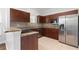Kitchen with stainless steel appliances, granite countertops, and wood cabinets at 658 Siren Wind Ln, Clearwater, FL 33756