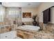 Bright bathroom showcasing a soaking tub, tiled shower, and decorative accents at 663 Turnberry Ct, Tarpon Springs, FL 34688