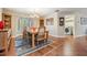 Cozy dining room area offering a warm ambiance, with convenient access to the laundry room at 663 Turnberry Ct, Tarpon Springs, FL 34688