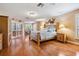 Bright and spacious main bedroom with wood floors and shutters on windows and doors at 663 Turnberry Ct, Tarpon Springs, FL 34688