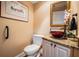 Chic powder room with decorative bowl sink and granite countertop at 663 Turnberry Ct, Tarpon Springs, FL 34688