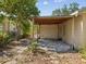 View of a covered back patio and backyard at 7012 Ponderosa Dr, Tampa, FL 33637