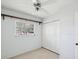 Bedroom featuring a window, closet, and ceiling fan at 7012 Ponderosa Dr, Tampa, FL 33637