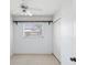 Bedroom featuring a window, closet, and ceiling fan at 7012 Ponderosa Dr, Tampa, FL 33637
