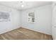 A light and airy bedroom featuring dual windows, a ceiling fan, and a closet at 7012 Ponderosa Dr, Tampa, FL 33637