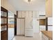 Bright eat-in kitchen with adjacent rooms showcasing an open layout and plenty of natural light at 7012 Ponderosa Dr, Tampa, FL 33637