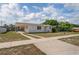 Charming single story home with well-maintained lawn at 7050 Merrick Ln, Spring Hill, FL 34606