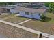 Beautiful home featuring a well-maintained lawn and inviting walkway at 7050 Merrick Ln, Spring Hill, FL 34606