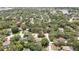 An aerial view showcases a lovely home surrounded by lush greenery and mature trees for ultimate privacy at 7233 Royal Oak Dr, Spring Hill, FL 34607