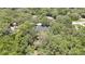 An aerial view showing the home nestled amongst the trees in a peaceful and secluded neighborhood at 7233 Royal Oak Dr, Spring Hill, FL 34607