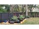 Enjoy a backyard with thriving raised gardens, offering fresh produce and a tranquil outdoor space perfect for relaxation at 7233 Royal Oak Dr, Spring Hill, FL 34607