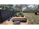 Lush backyard featuring raised garden beds, ideal for gardening enthusiasts seeking a peaceful outdoor retreat with natural beauty at 7233 Royal Oak Dr, Spring Hill, FL 34607