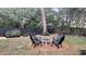 Serene backyard with a cozy patio setting, perfect for outdoor gatherings, surrounded by lush greenery and a peaceful ambiance at 7233 Royal Oak Dr, Spring Hill, FL 34607