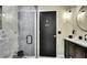 Sleek remodeled bathroom features a tiled glass-enclosed shower and modern vanity with great fixtures at 7233 Royal Oak Dr, Spring Hill, FL 34607