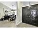 Inviting dining area visible from the entry featuring a modern chandelier and access to the main room at 7233 Royal Oak Dr, Spring Hill, FL 34607