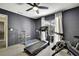 Brightly lit home gym with exercise equipment and a view, creating an inviting workout space at 7233 Royal Oak Dr, Spring Hill, FL 34607