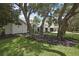Traditional home featuring well-maintained landscaping and mature trees at 7233 Royal Oak Dr, Spring Hill, FL 34607