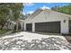 Traditional home with a two-car garage at 7233 Royal Oak Dr, Spring Hill, FL 34607
