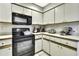 Efficient corner kitchen design with modern appliances at 7233 Royal Oak Dr, Spring Hill, FL 34607